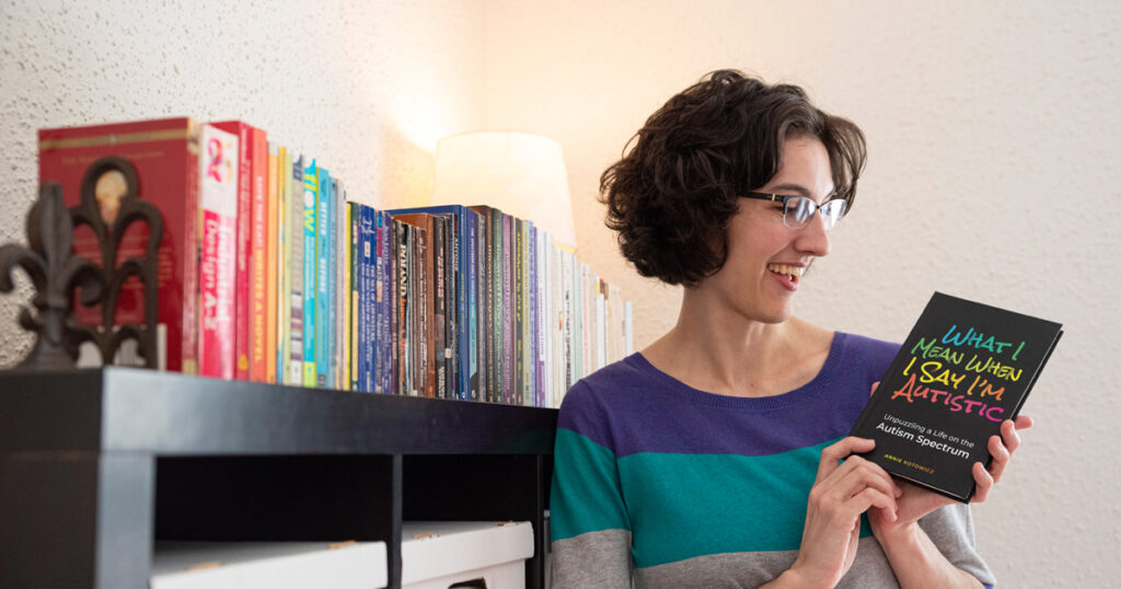Photo of Annie Kotowicz holding a book